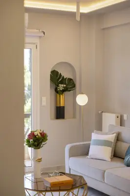 a living room with a couch and a table at Chrisostomou Square 14 Gold Apartment in Athens