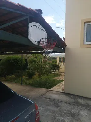 a basketball hoop attached to the side of a building at Country House in Anavyssos in Anavissos