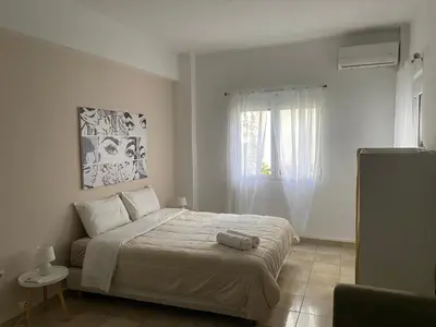 a bedroom with a bed and a window at Heart of Athens Monastiraki in Athens