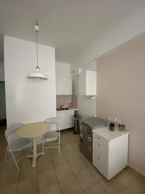 a kitchen with a table and a table and chairs at Heart of Athens Monastiraki in Athens