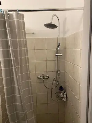 a shower in a bathroom with a shower curtain at Heart of Athens Monastiraki in Athens