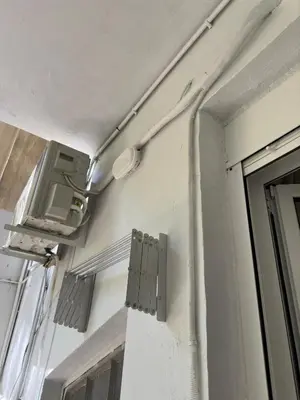 a wall with a air conditioner on the side of a building at Just For Two in Athens