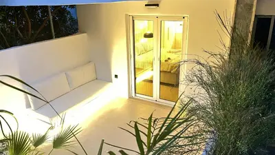 a room with a sliding glass door with a couch at Luxury Haven in Saronida