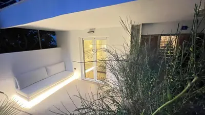 a room with a window with a couch in front at Luxury Haven in Saronida