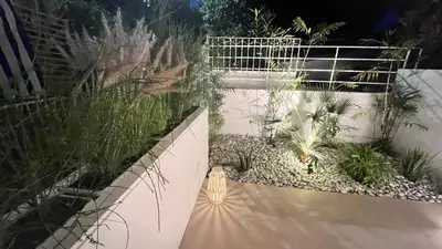 a garden with plants on the side of a fence at Luxury Haven in Saronida