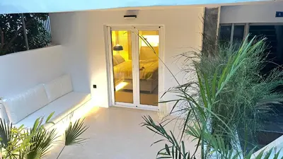 a room with a sliding glass door with a couch at Luxury Haven in Saronida
