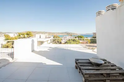 a balcony with a view of the ocean at RoofTop Sea View Cabin in Vari