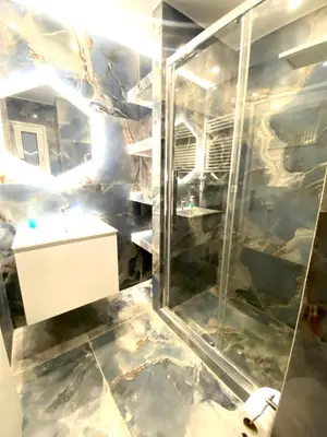 a bathroom with a sink and a shower at Soul spa suites in Athens