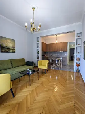 a living room with a couch and a table at Athenian Charm, Two-bedroom Flat in Athens