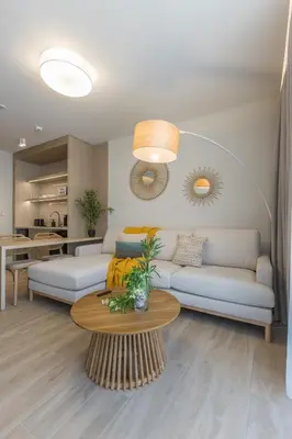 a living room with two couches and a table at The Mediterranean Suites in Piraeus