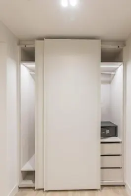 an open door to a closet in a room at The Mediterranean Suites in Piraeus