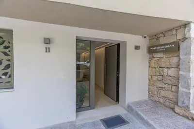a door to the entrance of a building at The Mediterranean Suites in Piraeus