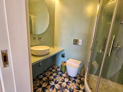 a bathroom with a sink and a shower at Acropolis Eternal Mansion by YHA in Athens