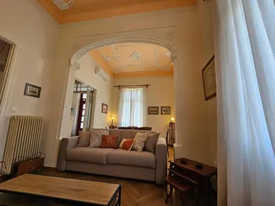 a living room with a couch and a table at Acropolis Eternal Mansion by YHA in Athens