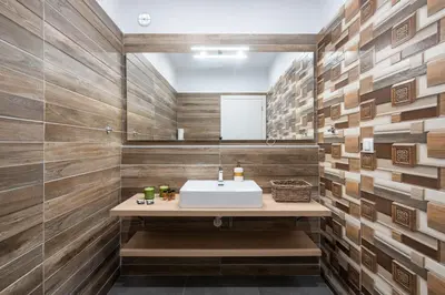 a bathroom with a sink and wooden walls at LIV - Sunny Penthouse Near Acropolis in Athens