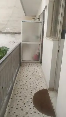 an empty refrigerator in a room with a rug at Modern Apartment in Athens in Athens