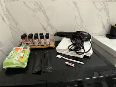 a black counter with alcohol bottles and a bag at Kipseli NEW MoDeRN & CoZy 65TV Netflix in Athens