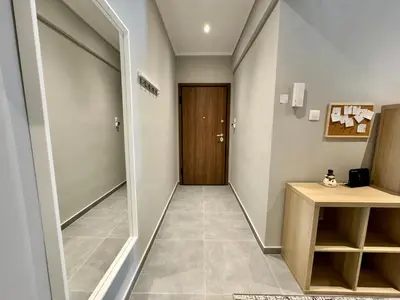 a hallway with a door leading to a room at Comfort Downtown Marble, Koukaki Athens in Athens