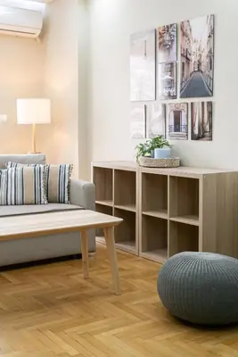 a living room with a couch and a coffee table at Filoxenia MG projects Alimos in Athens