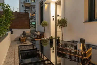 a balcony with potted plants on a building at Perth Luxury Living, Athens in Athens