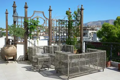 a group of cages on a balcony at Astric Seaview Penthouse in Athens