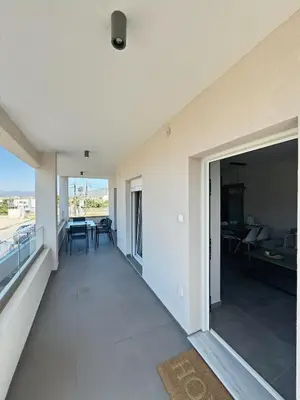 an empty living room with a view of the ocean at PUERTO VILLA, Best Location in Porto Rafti in Porto Rafti