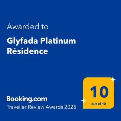 a yellow sign with the words awarded to gilaika platinumresurance at Glyfada Platinum Résidence in Athens