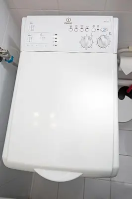a white washing machine in a bathroom at Lovely Cosy Apartment In Papagos in Athens