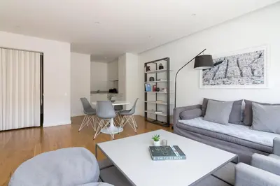 a living room with a couch and a table at Athens Trikoupi Suite E2 in Athens