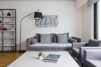 a living room with a couch and a table at Athens Trikoupi Suite E2 in Athens