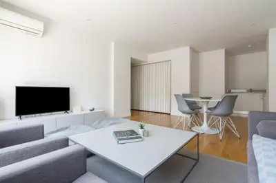 a living room with a couch and a table at Athens Trikoupi Suite E2 in Athens