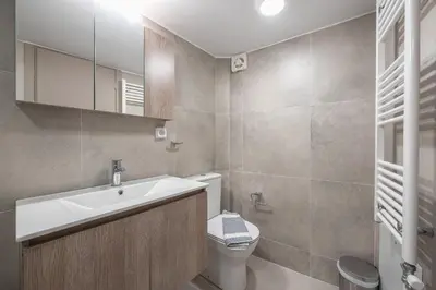 a bathroom with a sink and a toilet at Chic 2BR Apartment with Balcony in Athens