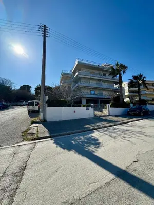 an empty street in front of a building at Artist Home in Porto Rafti