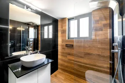 a bathroom with a sink and a mirror at Boutique39 Luxury Apartment Glyfada Athens in Athens