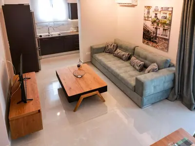 a living room with a couch and a coffee table at Katia Athens Apartment in Athens