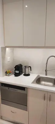 a kitchen with a sink and a pot on a stove at Alema Apartment in Athens