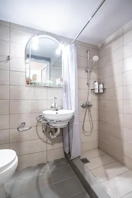 a bathroom with a sink and a shower at Cozy central apartment for 2 person by MPS in Athens
