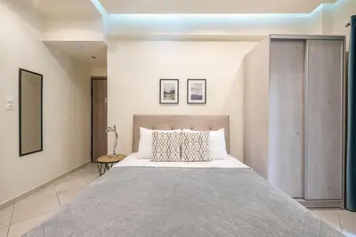 a bedroom with a large bed in a room at Cozy Apartment in Athens