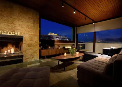 a living room with a couch and a fireplace at Outstanding Athens Apartment Karyatis Luxury Maisonette 3 Bedrooms in Athens