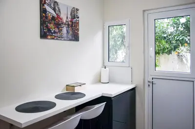 a bathroom with a sink and a window at Apartment in Alimos in Athens