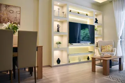 a dining room with a table and a window at Apartment in Alimos in Athens