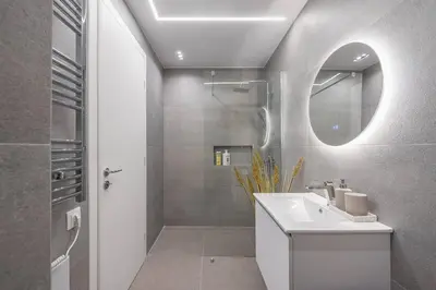 a bathroom with a white sink and a mirror at Athens Loft in Athens