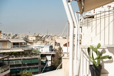 a view of a city from a balcony at Tsil House in Athens