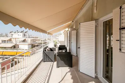 an apartment balcony with a view of the city at Tsil House in Athens
