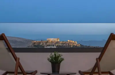 a large picture of a building on top of a mountain at The Meta Stay - Rooftop Access Central Studio in Athens
