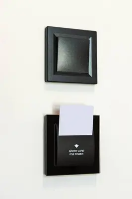 a black picture frame and a box on a wall at The Meta Stay - Backyard Oasis with Rooftop Access in Athens