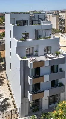 an aerial view of a white building at The Meta Stay - Rooftop Access Downtown Suite in Athens