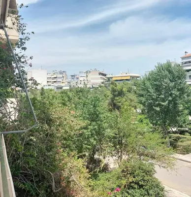 a view of a city with trees and buildings at Φωτεινό δίκλινο δωμάτιο με θέα! in Athens