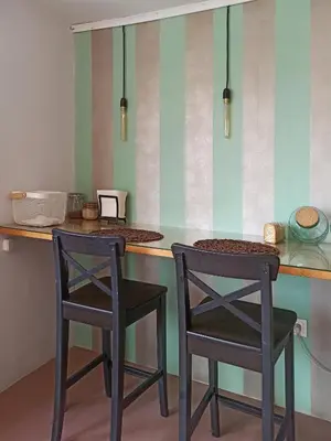 two chairs sitting at a counter in a kitchen at Terrace holiday studio apartment in Athens