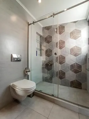 a bathroom with a shower and a toilet at Terrace holiday studio apartment in Athens